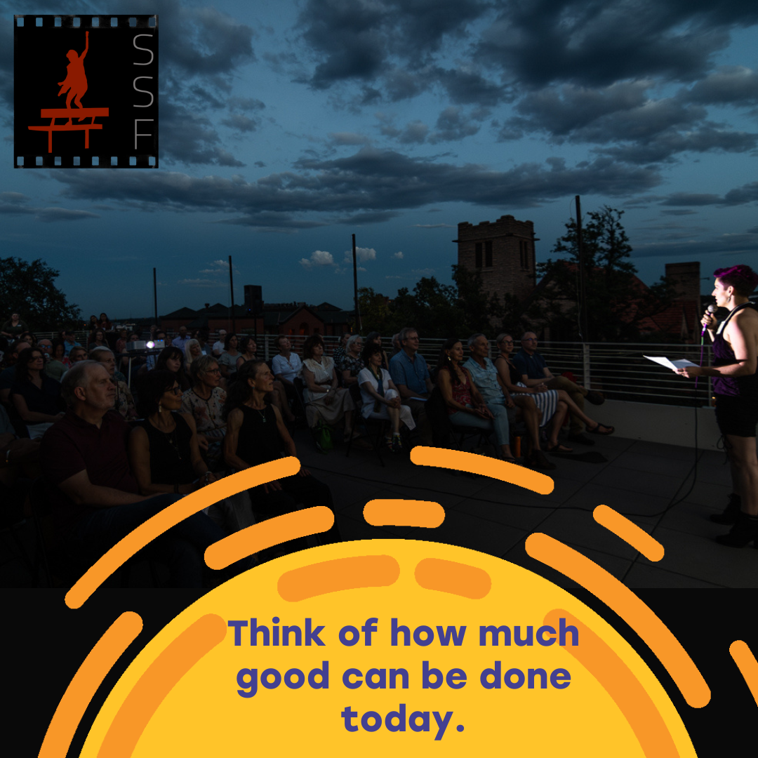 SSF executive director Michelle Bernier speaks to a large audience on a Boulder rooftop at the festival Premiere event